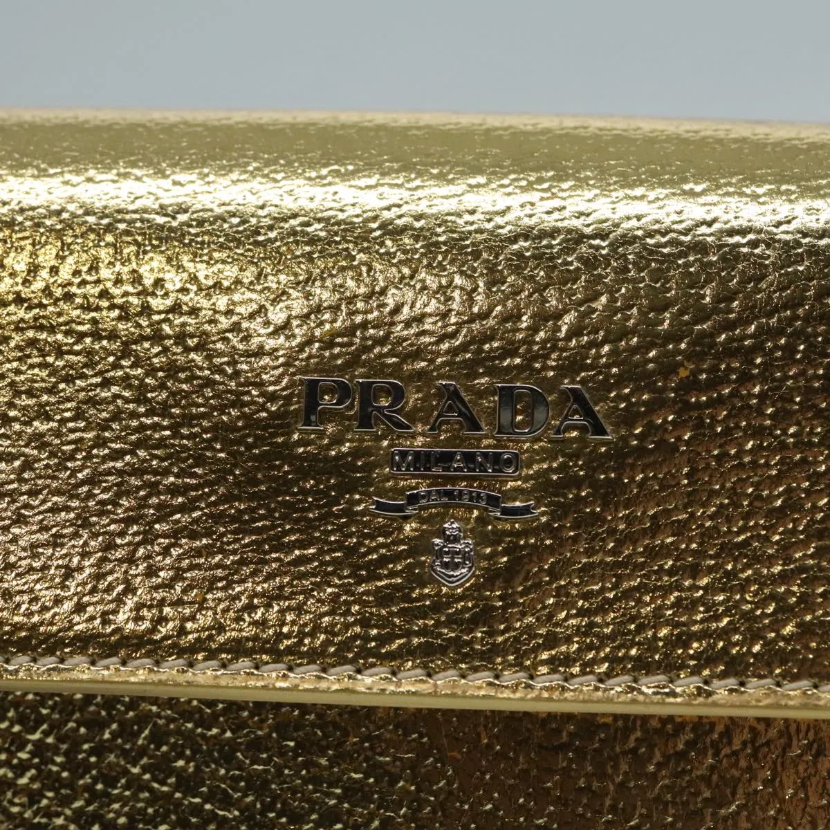 Prada -- Gold Leather Accessories