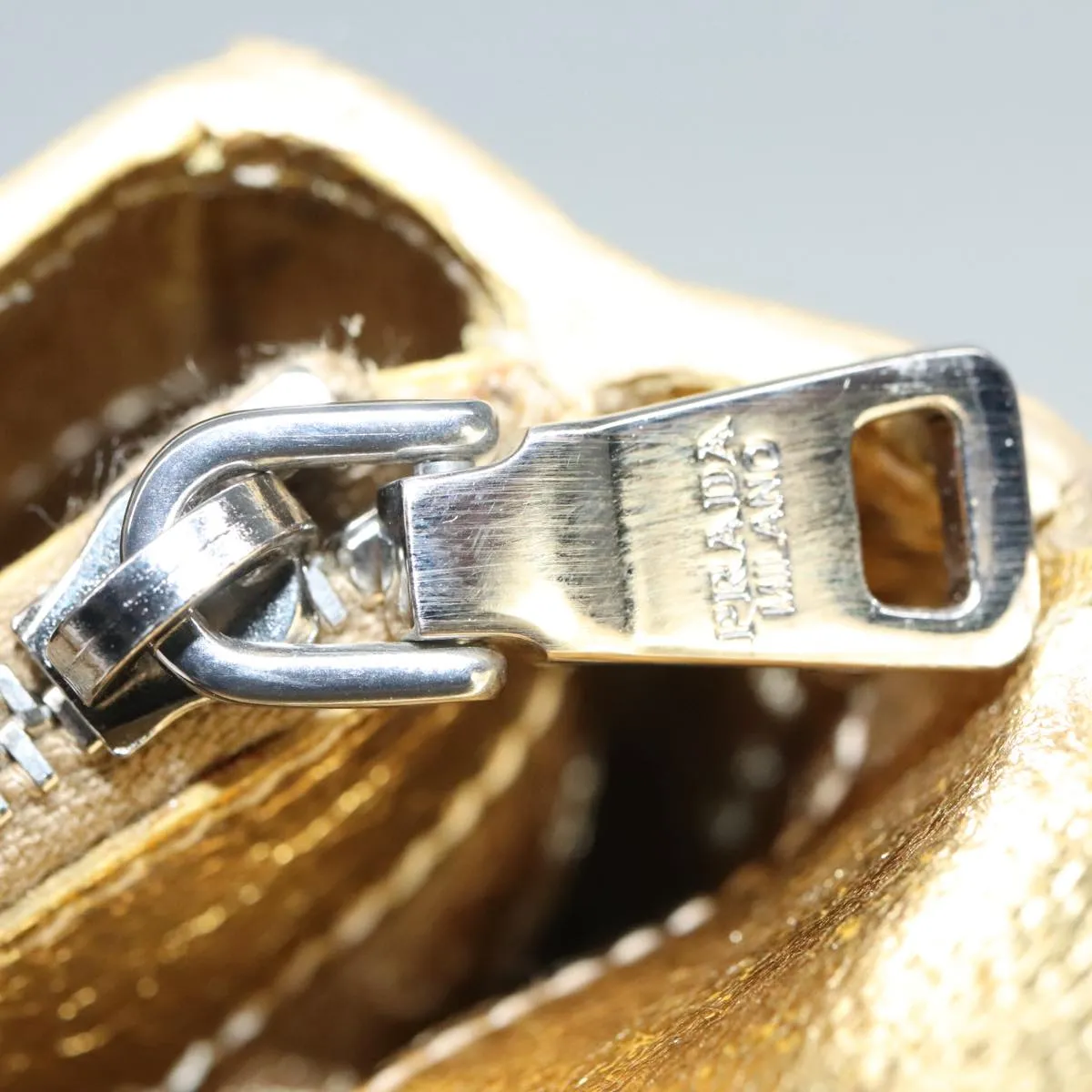 Prada -- Gold Leather Accessories