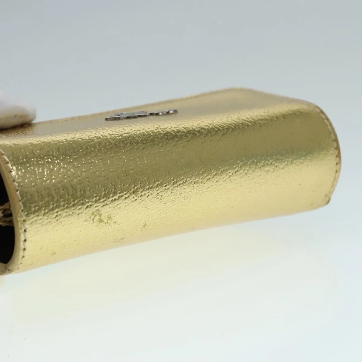Prada -- Gold Leather Accessories