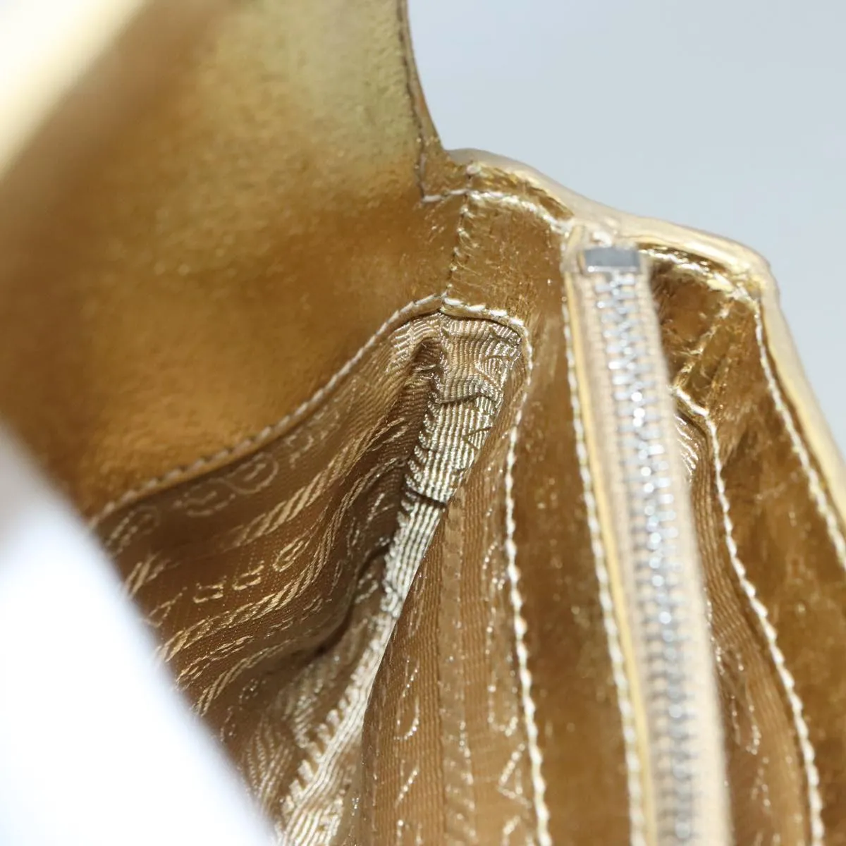 Prada -- Gold Leather Accessories