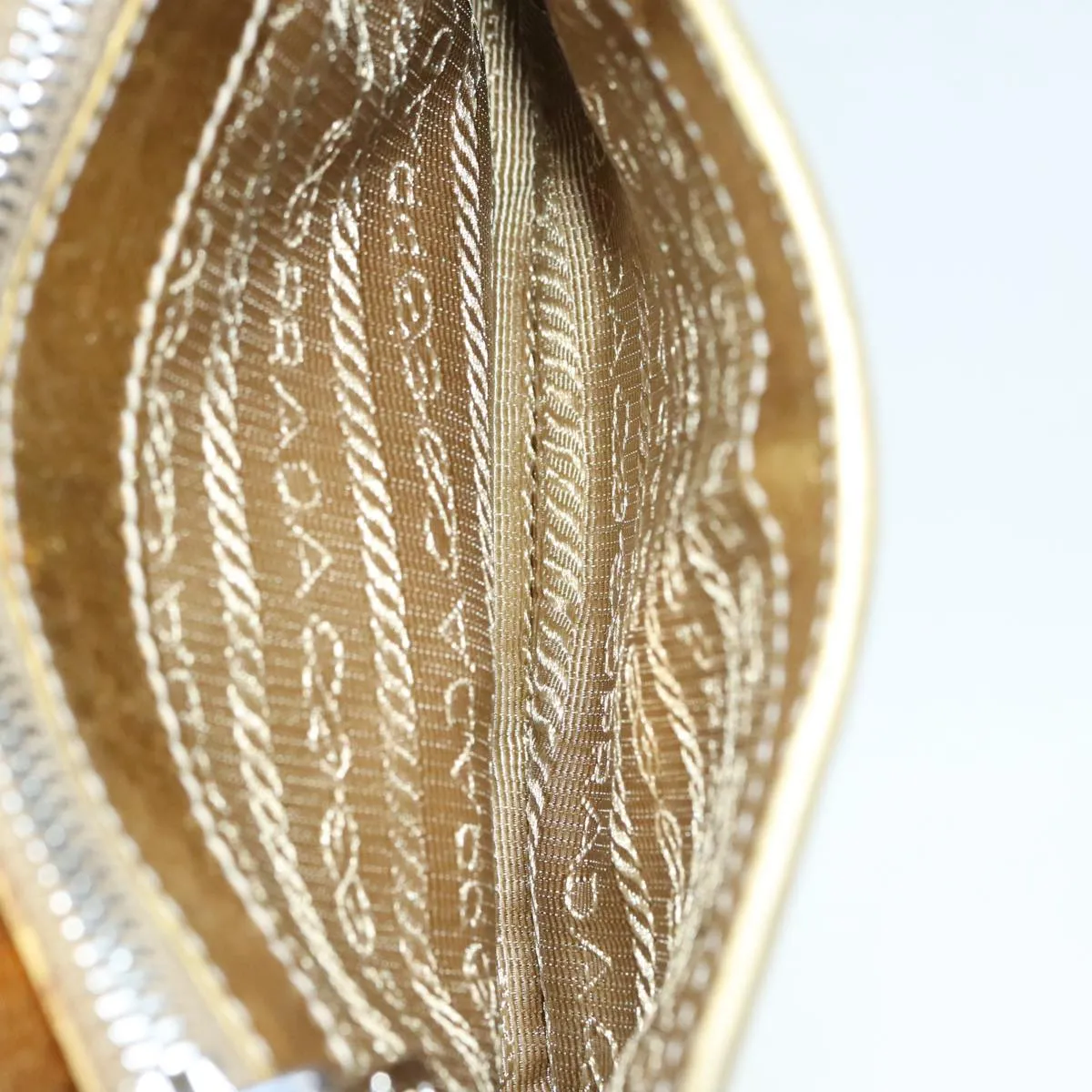 Prada -- Gold Leather Accessories
